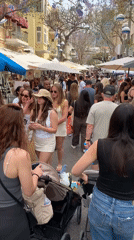 Tel-Aviv street market bustles with vendors, buskers, families