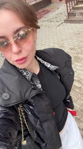 Woman films selfie video outdoors in Moscow