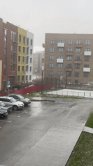 Heavy rain or hail observed over urban apartment buildings