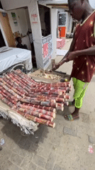 Nigerian street vendors operate produce and sugar cane stands