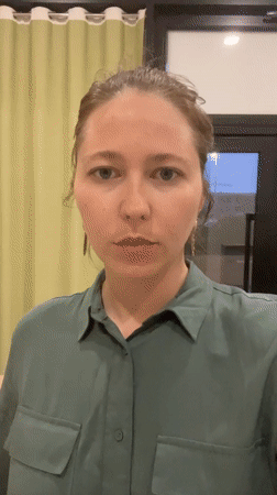 Woman in green shirt filmed in Podgorica apartment