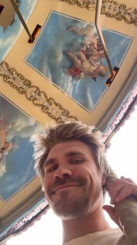 Man enjoys carousel ride at Tashkent amusement park