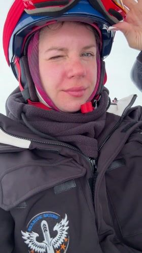 Skiers ride gondola lifts at Georgian resort during snow