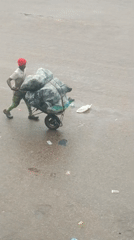 Morning street activity documented in rainy Bukuru, Nigeria