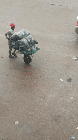 Morning street activity documented in rainy Bukuru, Nigeria
