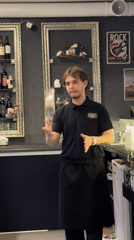 Bartender juggles bottle at establishment in Chaikovsky, Russia