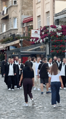 Daily life captured on Belgrade cobblestone streets during afternoon