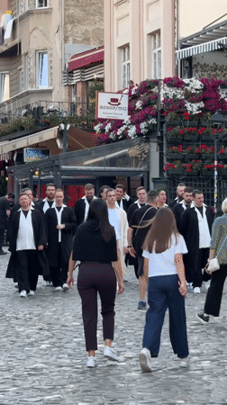 Daily life captured on Belgrade cobblestone streets during afternoon