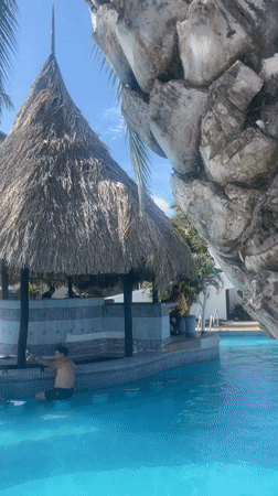 Swim-up bar action at a sunny Porlamar resort pool