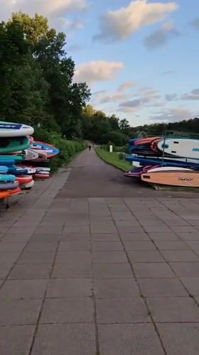 Lakeside evening at Rosinka — fountain, ducks, and paddleboards