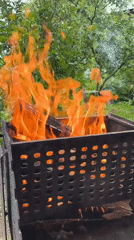 Fire burning in outdoor metal grills and braziers