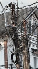 Tangled utility wires observed on pole in Đà Lạt