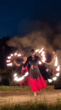 Fire dancers perform evening routine in Russian village