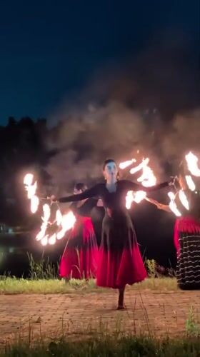 Fire dancers perform evening routine in Russian village