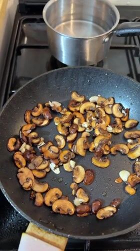 Shrimp, mushrooms, and garlic butter sauce coming together