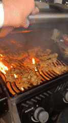 Evening barbecue cooking captured in Netanya urban setting