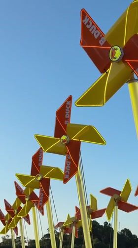 B. DUCK branded pinwheels spinning in Xiangzhou display installation