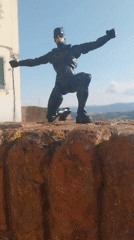Batman figurine tours medieval Peccioli, Tuscany