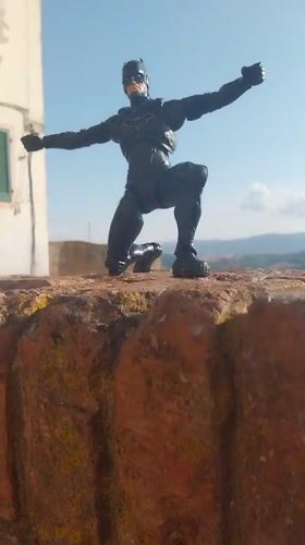 Batman figurine tours medieval Peccioli, Tuscany