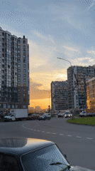 Sunset traffic scene captured on Russian urban street