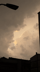 Overcast skies and rain observed in Milan evening
