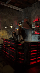 Two women pose at Moscow bar in dark clothing