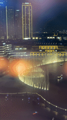 Evening scenes captured across Dubai include fountains, lights, transit