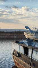 Visitors explore Chaikovsky harbor and industrial waterfront areas