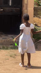 Girl jumps rope on sunny day in Gura Top