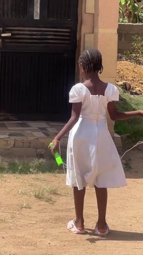 Girl jumps rope on sunny day in Gura Top