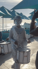 Disco ball performers entertain tourists on Indonesian beach