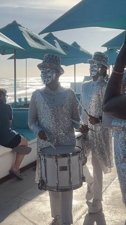 Disco ball performers entertain tourists on Indonesian beach
