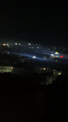 Night views captured of town featuring Pirin stadium