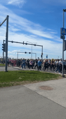 Group in athletic wear crosses street in Tallinn