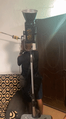 Man drills wall during home improvement project