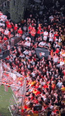Big outdoor crowd gathers at night in Las Rozas de Madrid