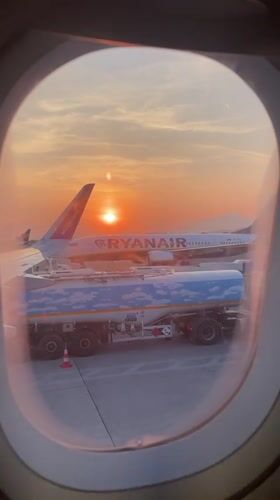 Passenger captures sunset tarmac scene at Italian airport