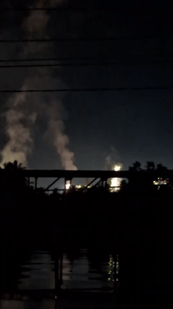 Nighttime fireworks display creates illuminated smoke plume over Palohlada waters
