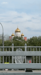 Orthodox church with golden domes spotted from moving vehicle in Moscow
