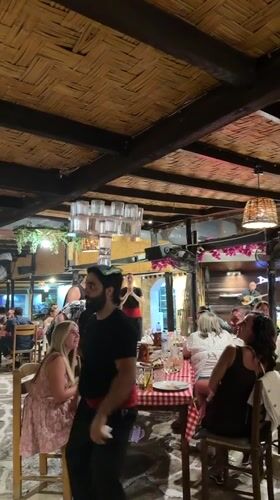 Traditional Greek folk dancers perform at Paphos restaurant