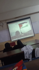 Classroom in Peshawar shows Palestinian flag image via projector