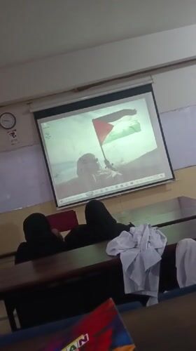 Classroom in Peshawar shows Palestinian flag image via projector