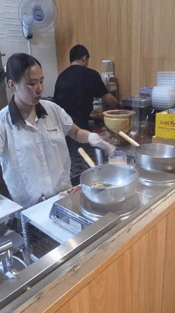 Restaurant staff prepare lunch service in Phu Thuy Ward