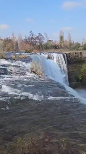 Tourists document scenic Laja Falls waterfall in Cabrero, Chile