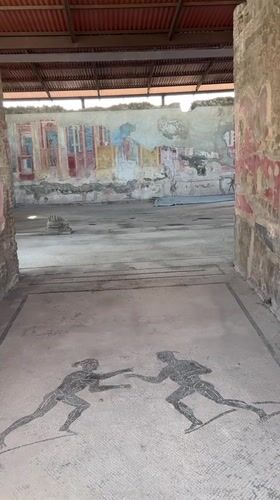 Tourist captures ancient mosaics and frescoes at Pompeii ruins