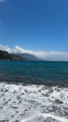Peaceful coastal moment captured as jet crosses sunny Montenegro sky
