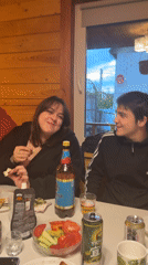 Friends gather for casual dinner party at Russian cabin