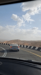 Driver films another car on desert road near Dimona