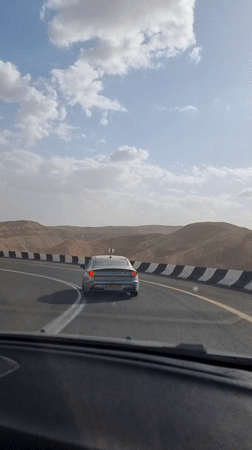 Driver films another car on desert road near Dimona
