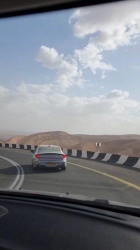 Driver films another car on desert road near Dimona